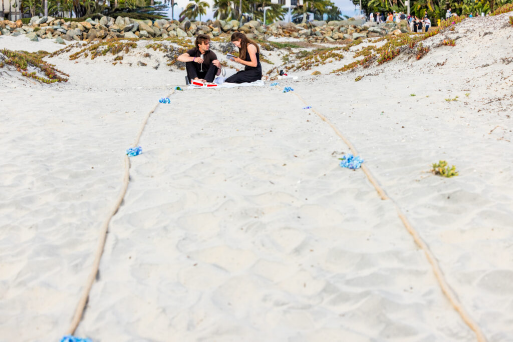 Coronado Engagement Photographer | The Sweetest Shell Hunt Proposal in the Sand Dunes proposal on the beach in coronado 7